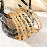 Conjunto Aura — 7 Pulseiras Douradas | NORVÉLIA